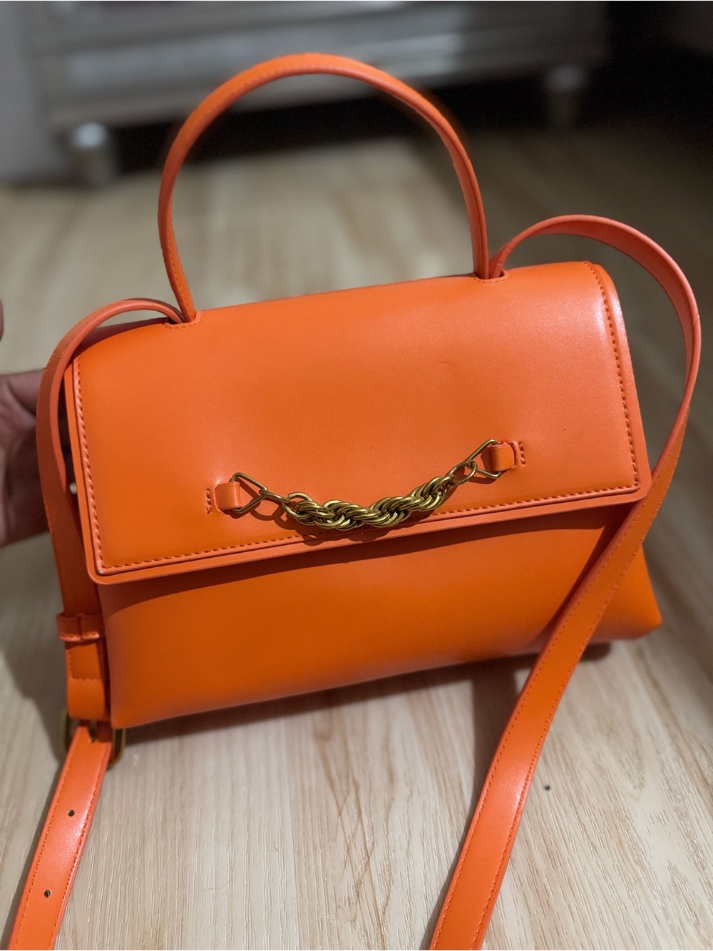 Structured Orange Leather Satchel with Gold Chain Accent